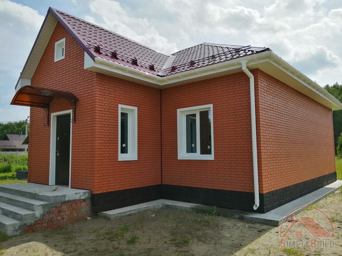 Водосточная система Дёке Люкс пломбир на красном доме